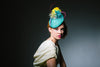 Green Sinamay Ascot Headpiece with Feather Flowers by Genevieve Rose Atelier